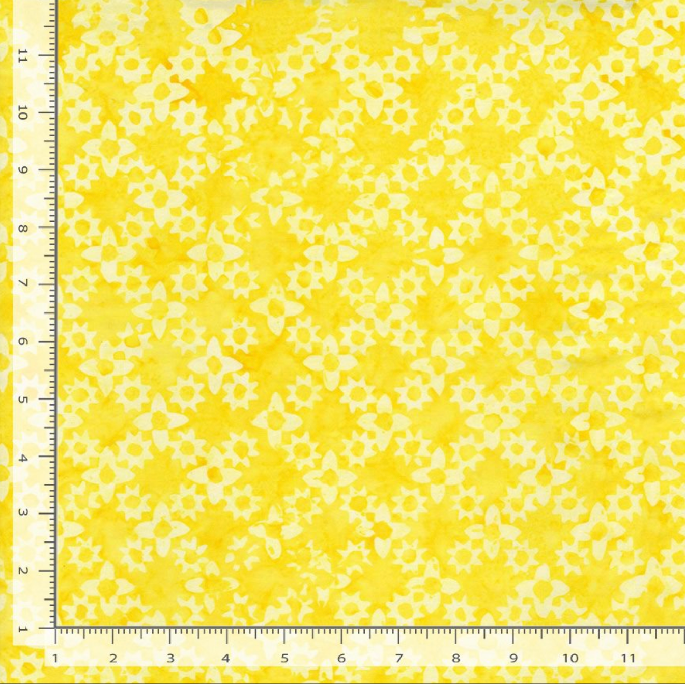 Flower Grove Sun Tonga Batik fabric by Timeless Treasures featuring small tonal floral shapes in bright yellow, golden yellow, and cream.