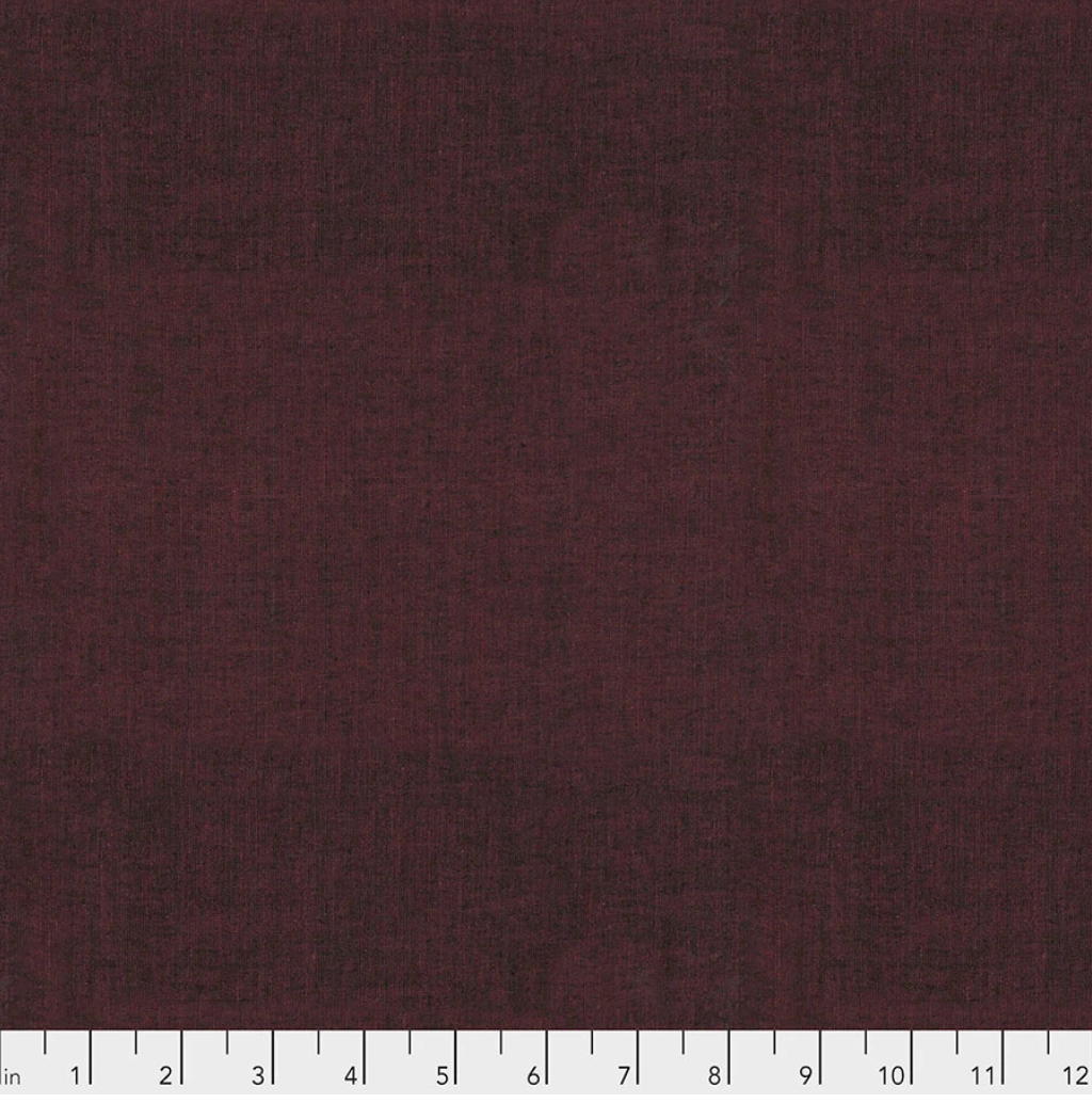Kaffe Fassett Shot Cotton Plum fabric by FreeSpirit Fabrics featuring a deep plum-burgundy woven texture with subtle tonal variation.