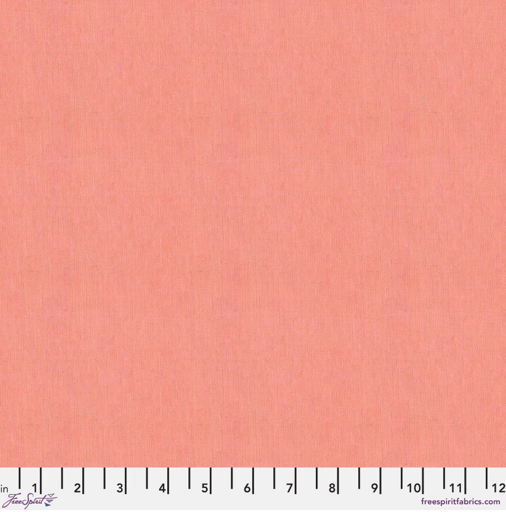 Kaffe Fassett Shot Cotton Strawberry Blonde fabric by FreeSpirit Fabrics featuring a soft peachy pink and coral woven texture.