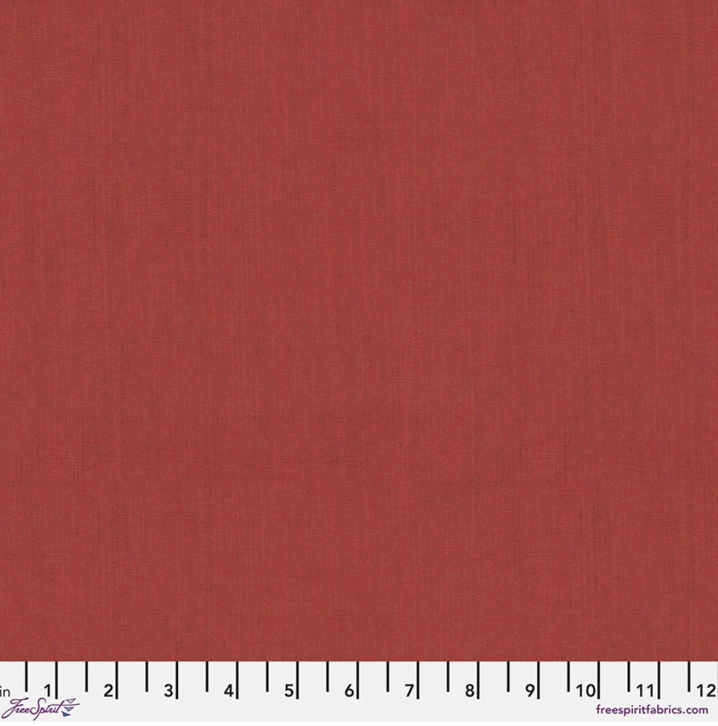 Kaffe Fassett Shot Cotton Rust fabric by FreeSpirit Fabrics featuring a warm rust red and terracotta woven texture.