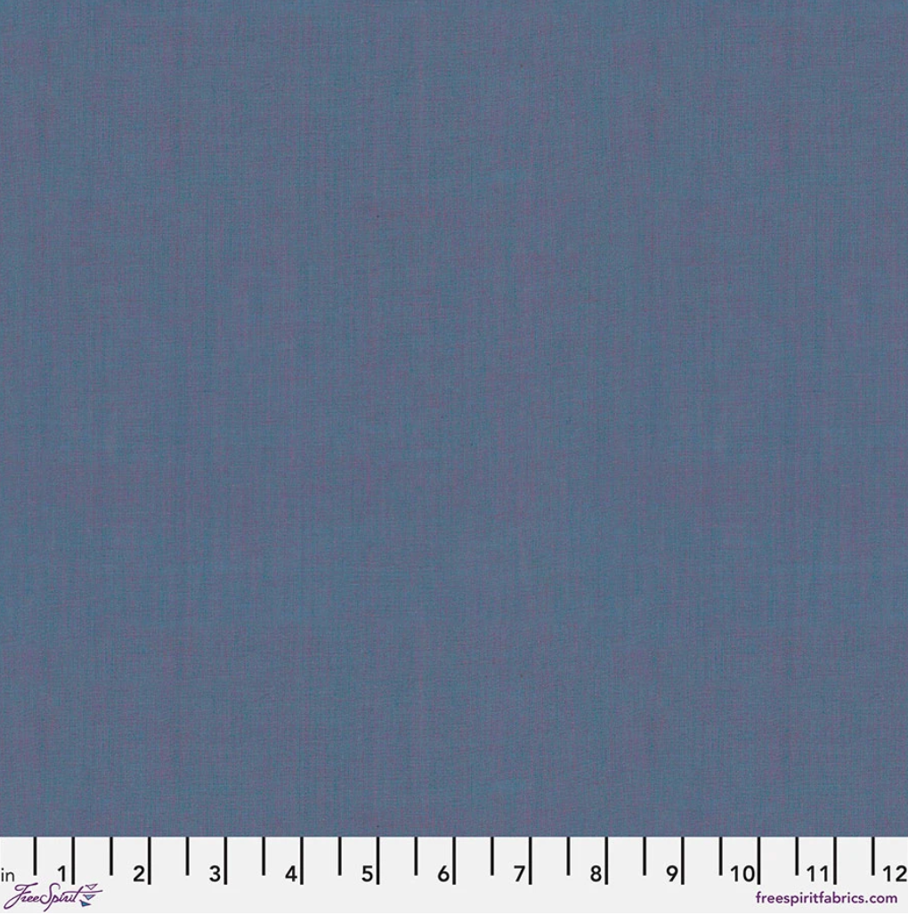 Kaffe Fassett Shot Cotton Ocean fabric by FreeSpirit Fabrics featuring a soft ocean blue woven texture with subtle purple tonal variation.