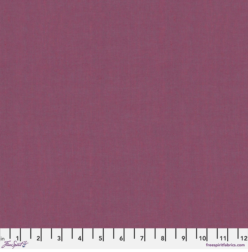 Kaffe Fassett Shot Cotton Grape fabric by FreeSpirit Fabrics featuring a muted grape-purple woven texture with soft berry undertones.