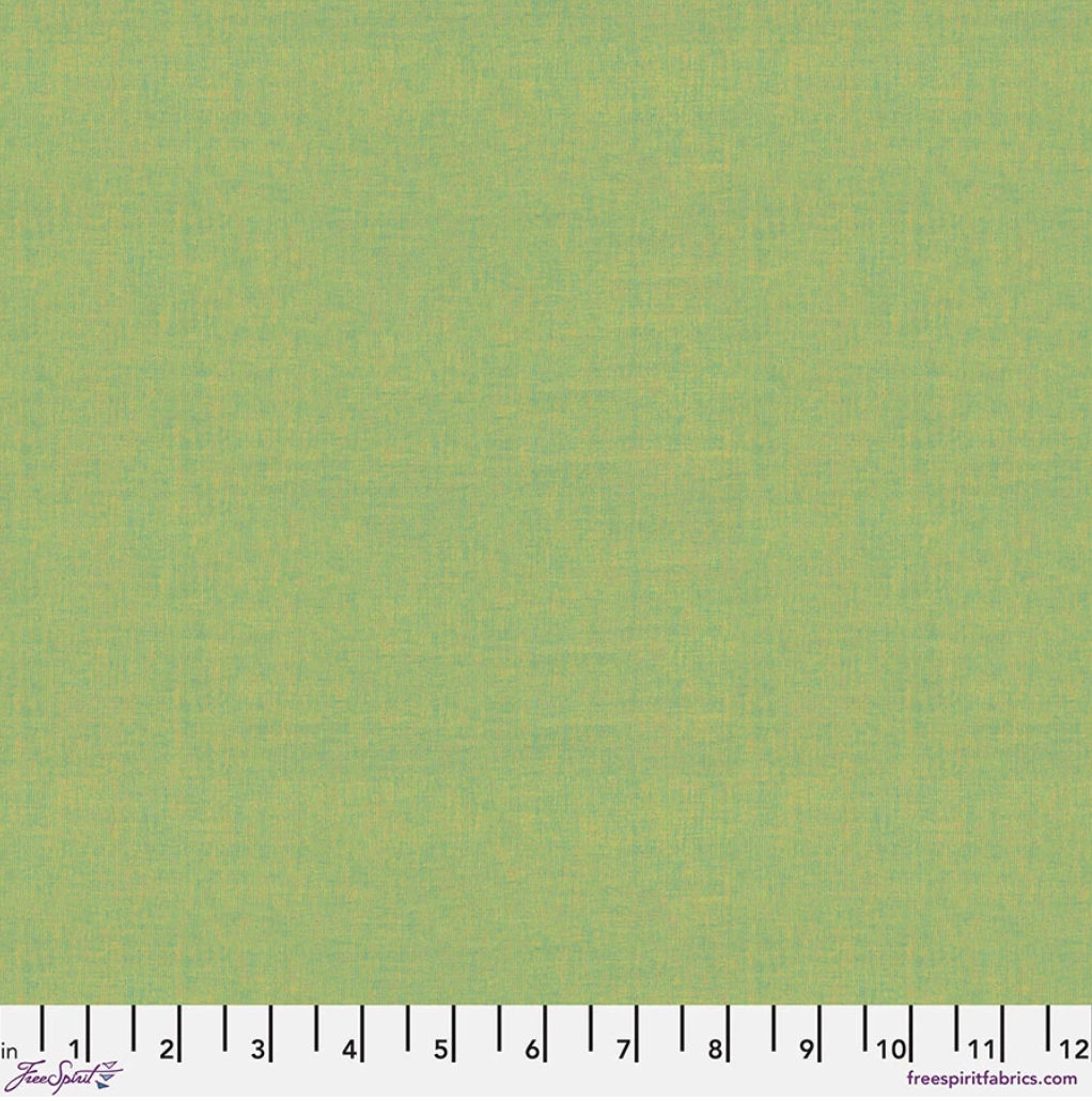 Kaffe Fassett Shot Cotton Apple fabric by FreeSpirit Fabrics featuring a fresh apple green woven texture with subtle yellow undertones.
