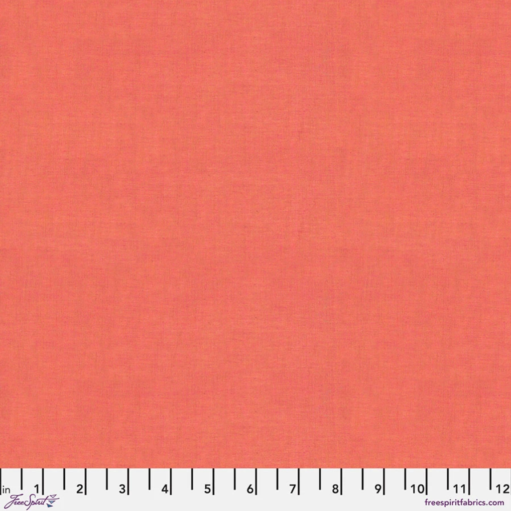 Kaffe Fassett Shot Cotton Persimmon fabric by FreeSpirit Fabrics featuring a warm coral-orange woven texture with subtle tonal variation.