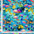 Coral Reef Fish cotton fabric by Timeless Treasures featuring colorful tropical fish swimming through bright blue coral reefs.
