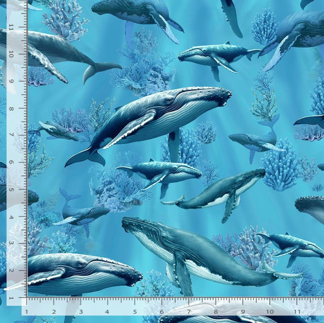 Humpback Whale cotton fabric by Timeless Treasures featuring whales swimming through blue ocean water with coral and underwater plants.