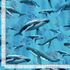 Humpback Whale cotton fabric by Timeless Treasures featuring whales swimming through blue ocean water with coral and underwater plants.