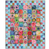 Kaffe Fassett Seed Packet quilt featuring colorful floral patchwork made with FreeSpirit fabrics