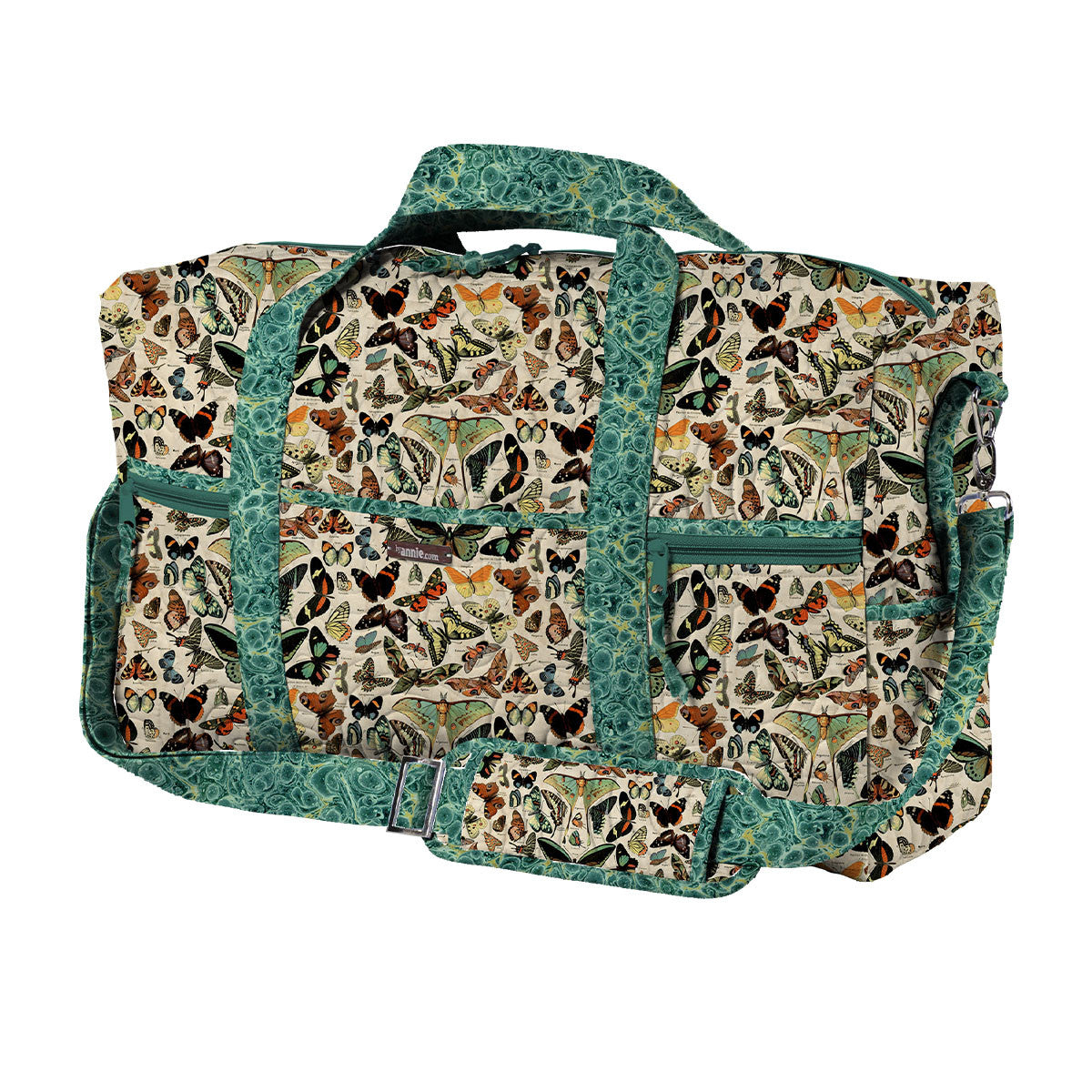 Travel duffel bag sewn from Tim Holtz Palette Teal Butterflies cotton canvas, showcasing vintage butterfly and moth fabric for stylish handmade travel bags and accessories.