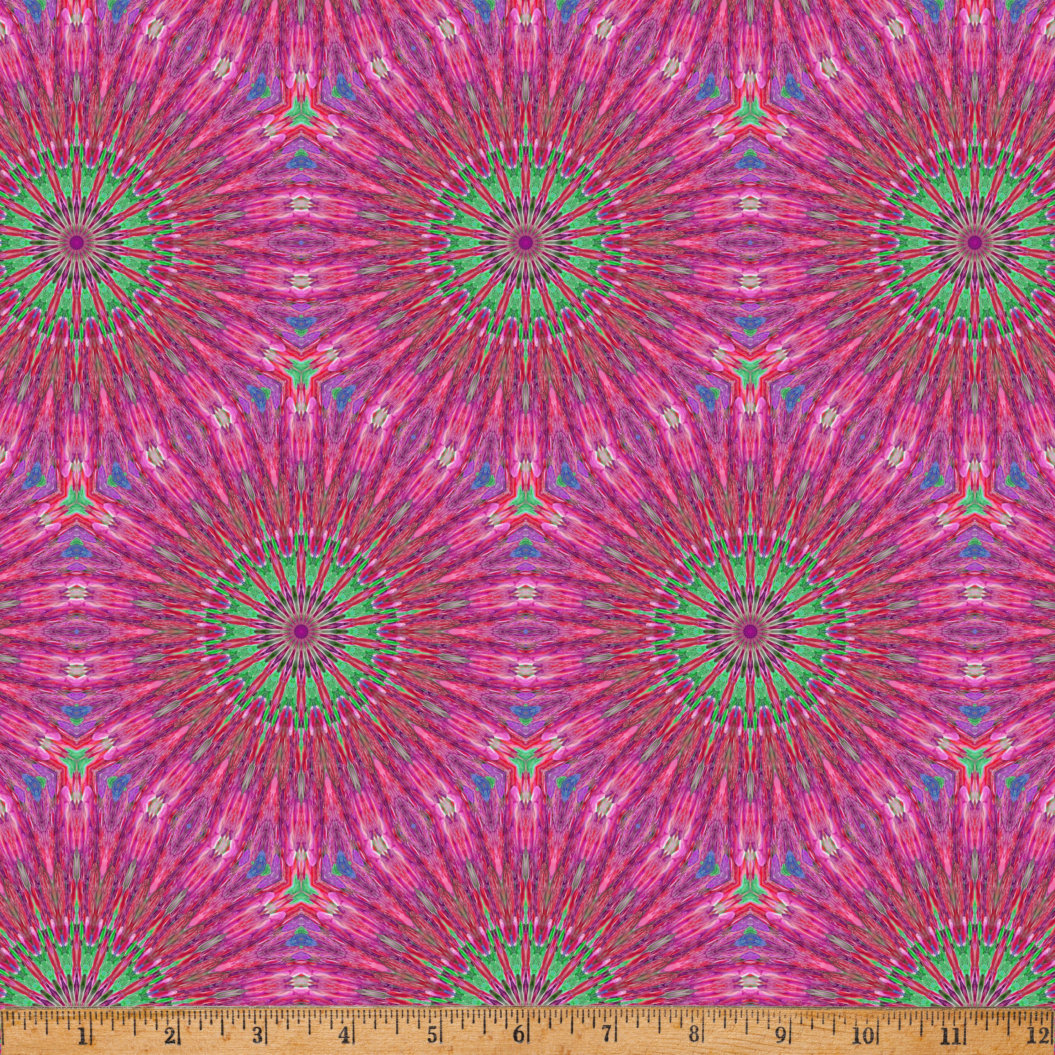 Radiant Kaleido Star Pink digital print fabric by Marlies Janssen of Candy Quilt Designs for Hoffman Fabrics featuring vibrant kaleidoscope starbursts in shades of pink, magenta, coral, turquoise, mint green, and purple on premium quilting cotton.