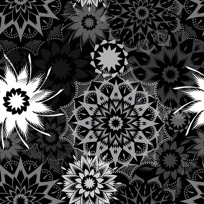 Silhouette Stars Noir 108-inch wide quilt backing fabric by Judy and Judel Niemeyer for Timeless Treasures featuring black, charcoal, grey, and white layered starburst and floral geometric motifs.