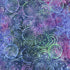 Suzani Paradise 108-inch wide batik quilt backing fabric by Timeless Treasures featuring layered circular motifs in purple, violet, blue, teal, green, aqua, and pink.