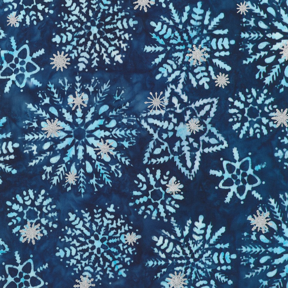 Artisan Batiks Evergreen Ice Sparkle Frosted Snowflakes Blue premium cotton batik featuring large frosted snowflakes with metallic silver accents on a deep navy and icy blue hand-dyed background by Lunn Studios for Robert Kaufman.