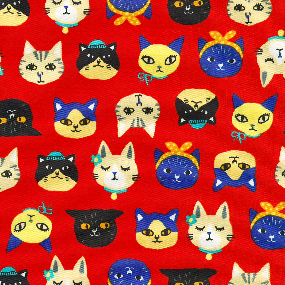 Sevenberry Canvas Cats Red fabric by Robert Kaufman featuring colorful illustrated cat faces on a vibrant red cotton canvas, perfect for bags, home décor, quilting, and fun sewing projects.