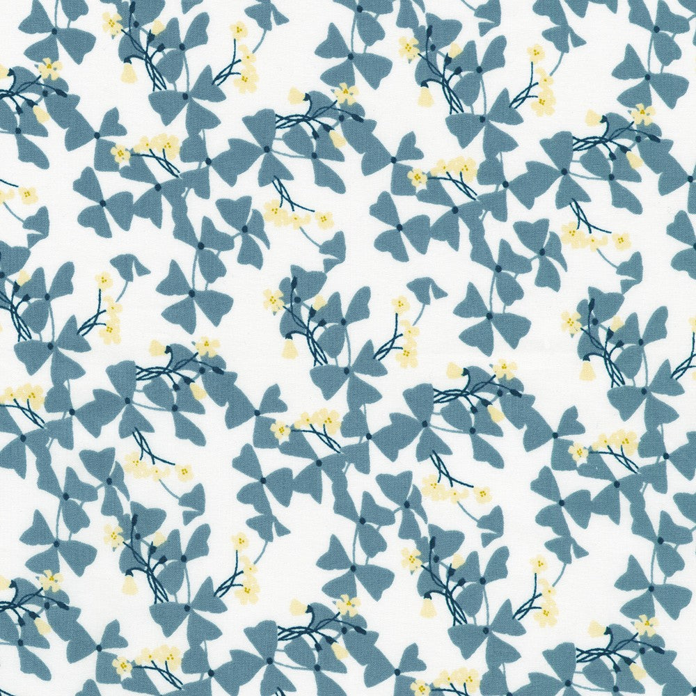 Crystal Lawn Vine Leaves White Japanese cotton lawn fabric by Sevenberry for Robert Kaufman featuring blue-green vine leaves with delicate yellow blossoms on a white background.