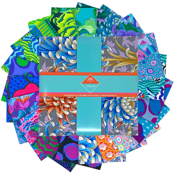 Kaffe Fassett August 2025 Cool 10 inch layer cake with blue green floral prints.