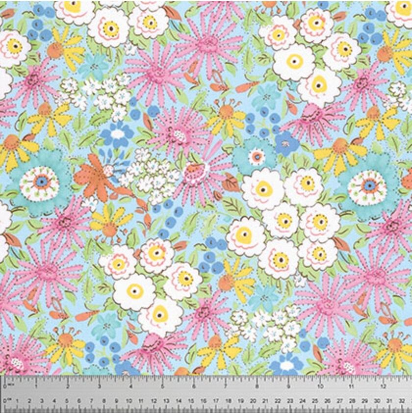 Colorful pastel flowers in pink, blue, yellow, and white on a sky blue background cotton fabric, Morning Glory Pink from the Meadow collection by Dena Designs.