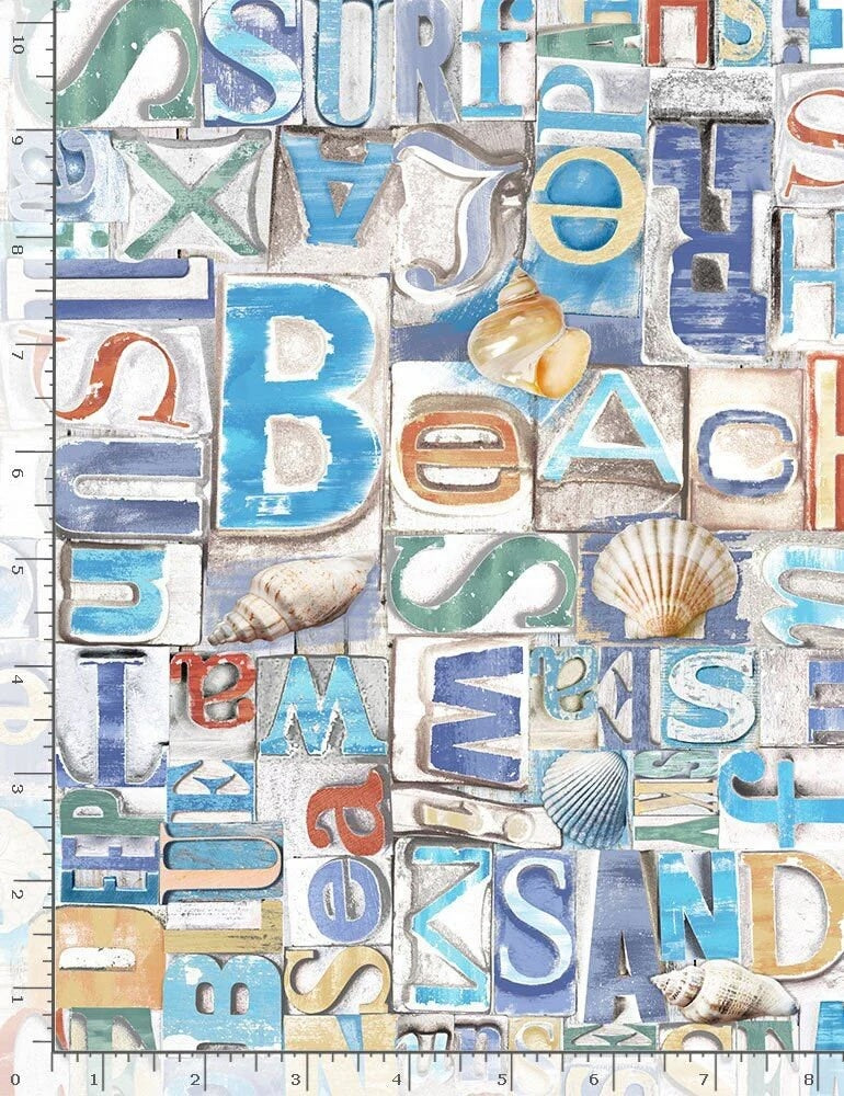 Coastal cotton fabric featuring beach-themed words, seashells, sand dollars, and nautical typography in blue, tan, and white tones.