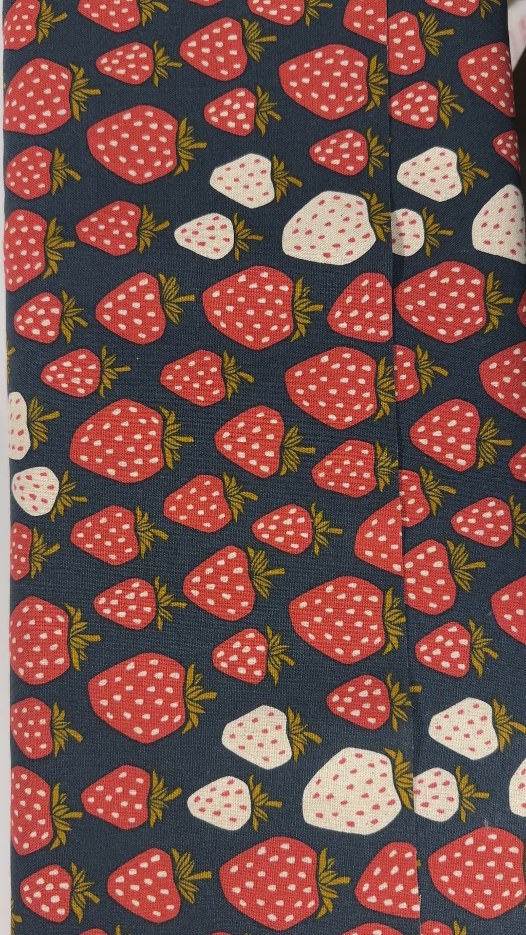 Under the Apple Tree Queen of Berries Starry Night Unbleached Canvas Fabric by Loes Van Oosten for Cotton + Steel featuring red and cream strawberries on navy background.