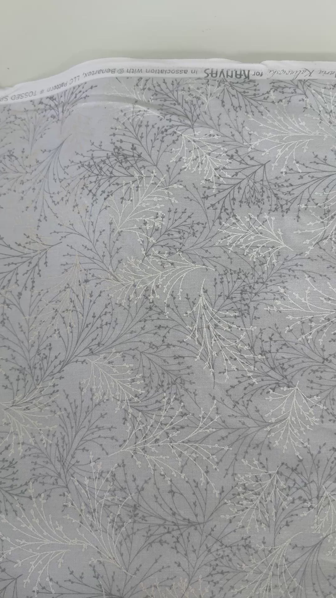 Pearl gray cotton fabric featuring delicate silver metallic botanical sprigs and branches by Kanvas Studio for Benartex.