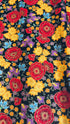 Florentine Garden Floral Multi Metallic cotton fabric by Hyun Joo Lee for Robert Kaufman featuring vibrant red, gold, purple, and blue flowers with metallic accents on a black background.