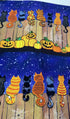 Feline Spooky Cats on Fence cotton fabric by Timeless Treasures featuring colorful Halloween cats, pumpkins, spider webs, and a rustic wooden fence.