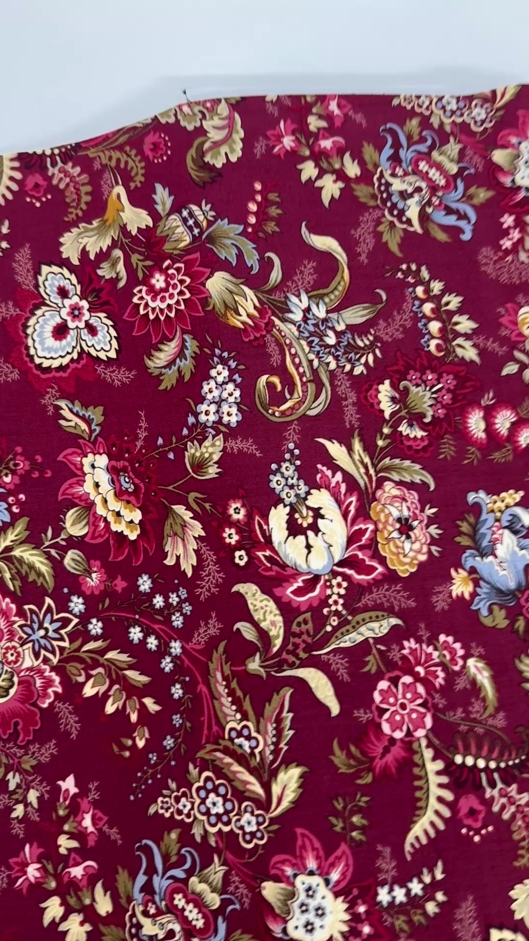 Marseille Red floral cotton fabric by Dover Hill for Benartex featuring ornate botanical flowers and foliage in burgundy, gold, cream, olive green, and blue on a rich red background.