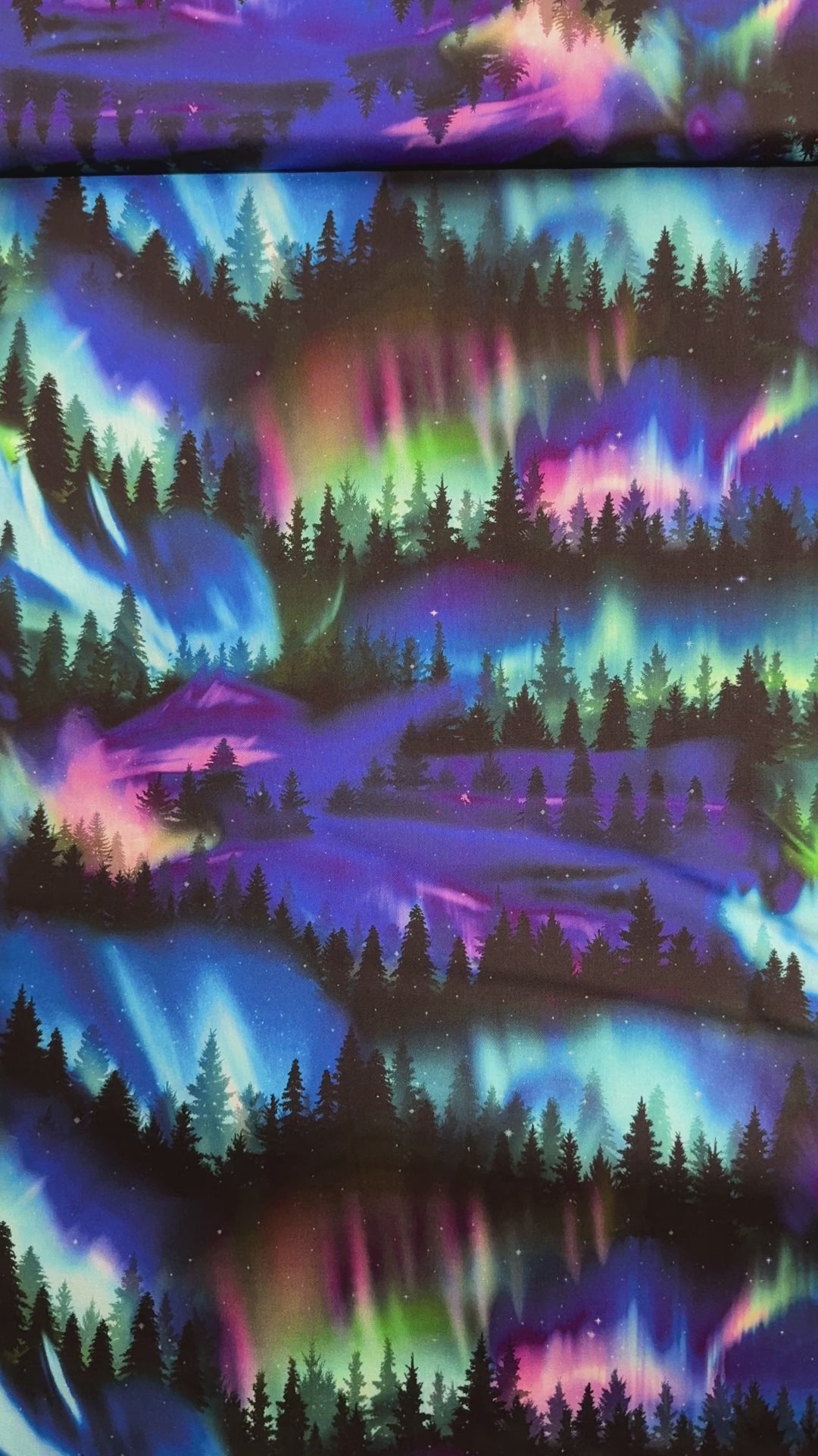Winter Light - Trees Aurora Borealis fabric by Timeless Treasures, 100% cotton with a scenic forest under colorful aurora sky.