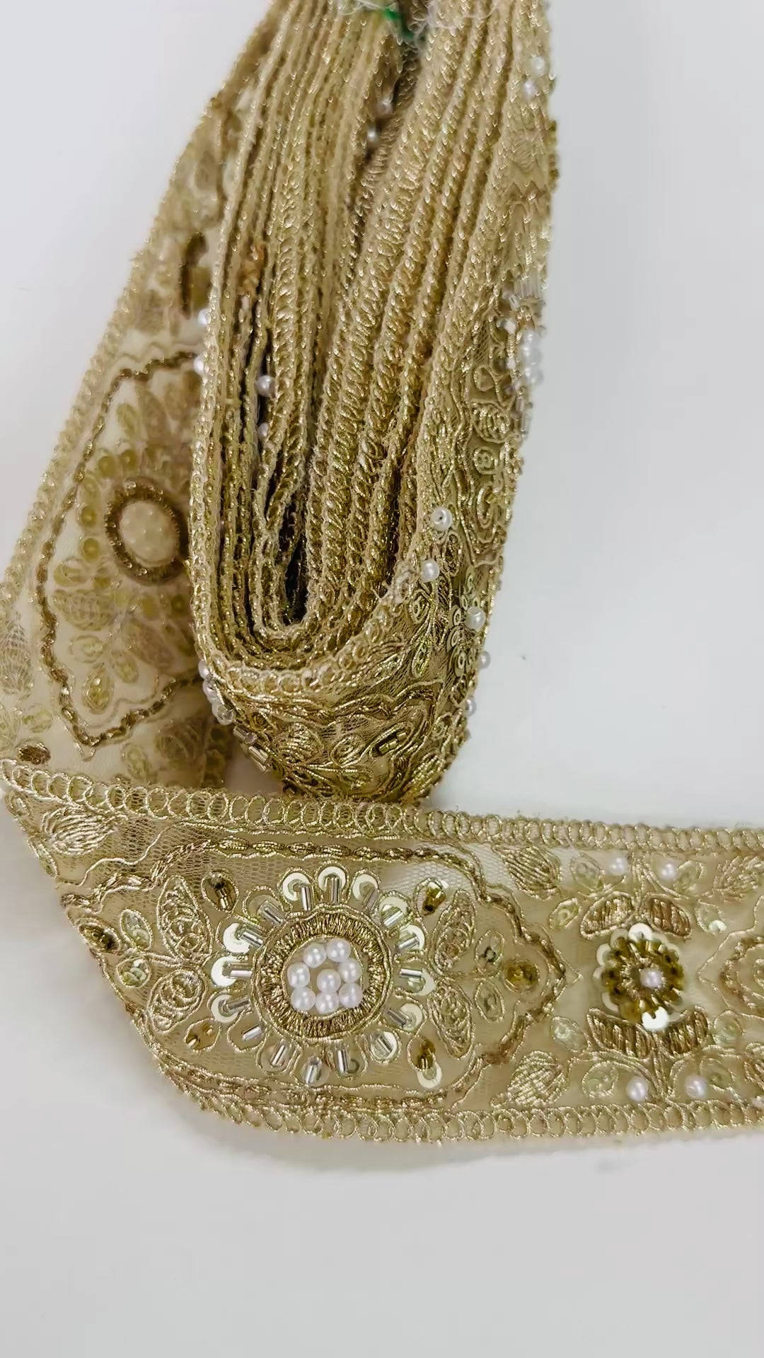 Gold embroidered lace trim with floral beadwork and sequin details for garment borders and crafts