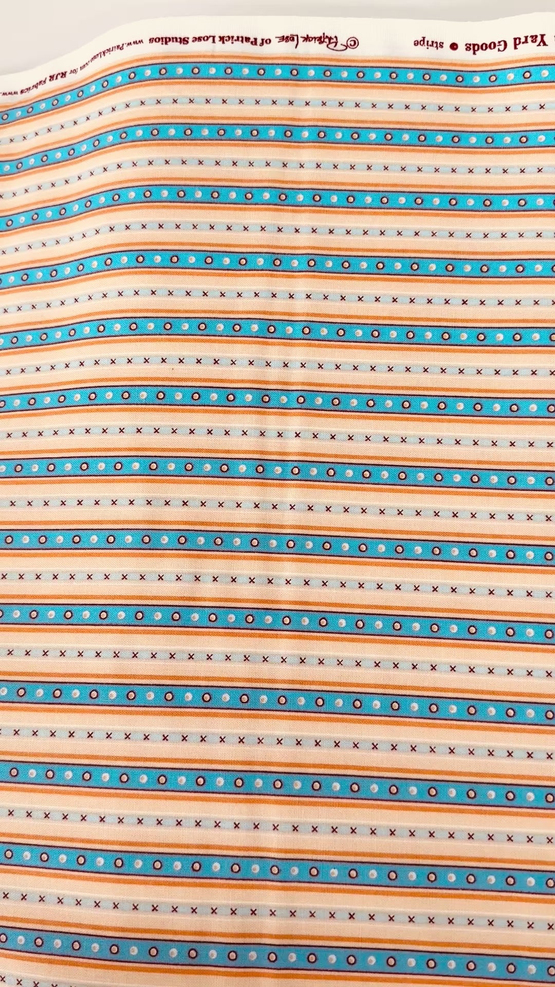Chambray blue and tan narrow stripe cotton fabric by Patrick Lose for RJR Fabrics.
