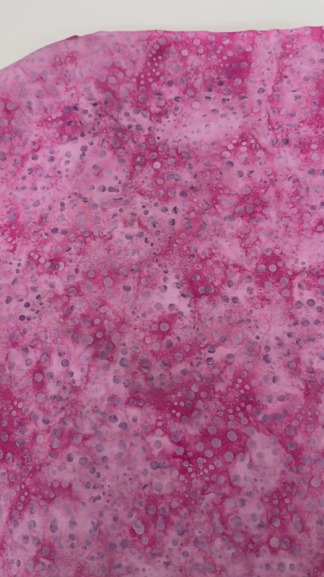 Bursts Rose Batik Fabric by Jinny Beyer – hand-dyed pink cotton batik with subtle bursts from Malam Batiks VIII by RJR Fabrics.