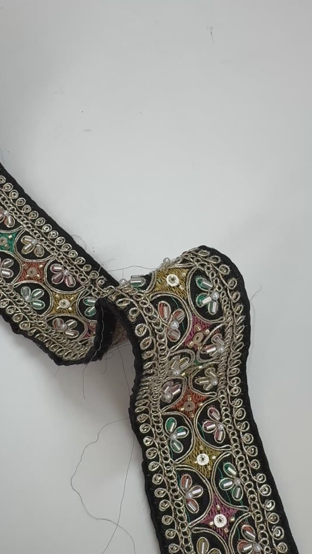 Multicolor embroidered trim on black with beads, sequins, and metallic thread detailing for lehengas, sarees, dupattas, costumes, accessories, and sewing projects.