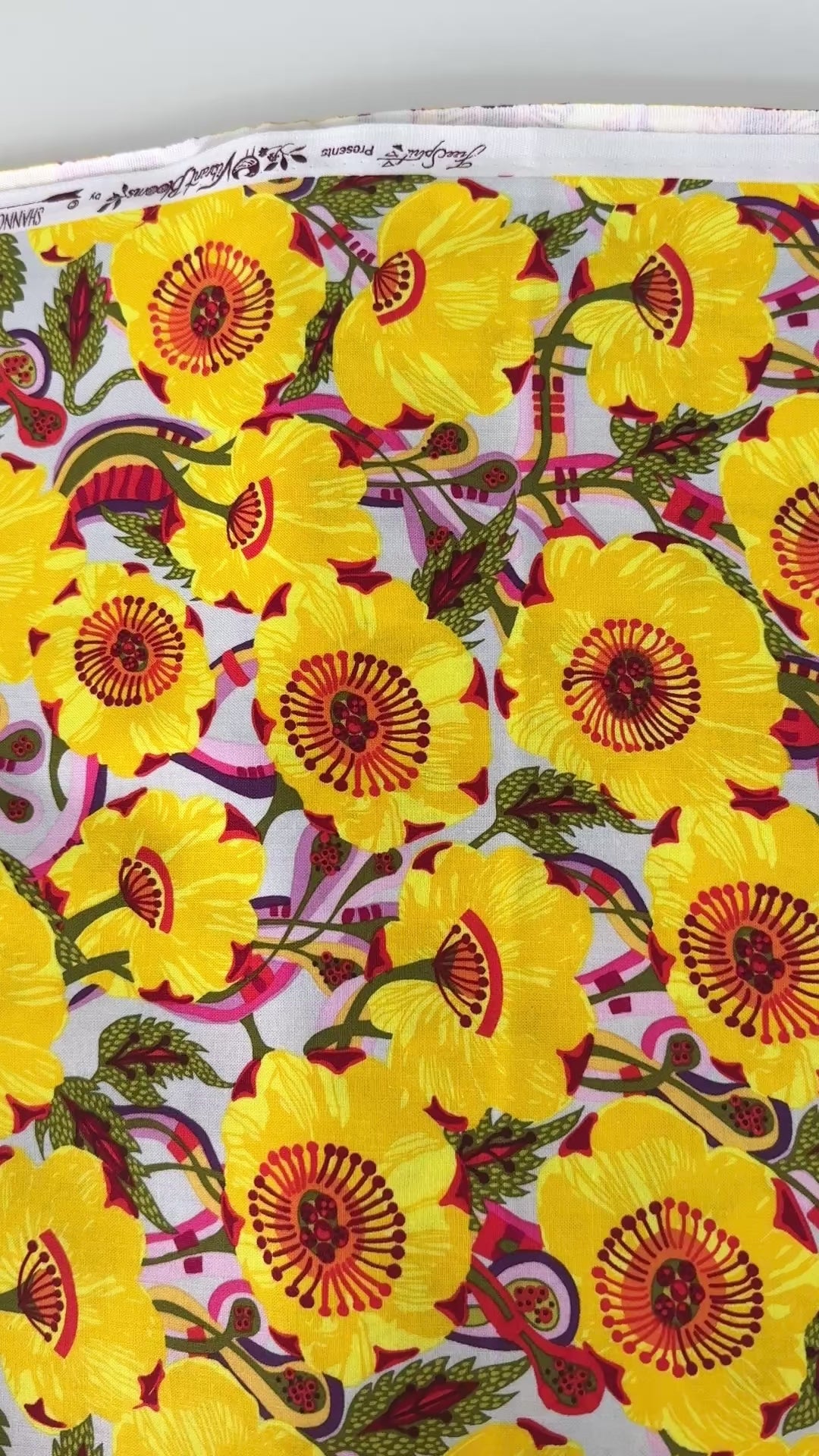 Sunshine Bloom Yellow floral fabric with bright golden flowers and red centers.